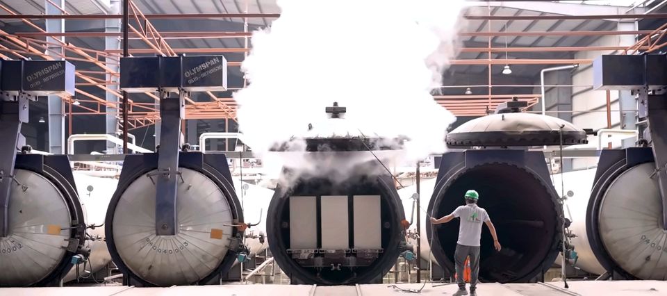 An autoclave opened in a cloud of steam